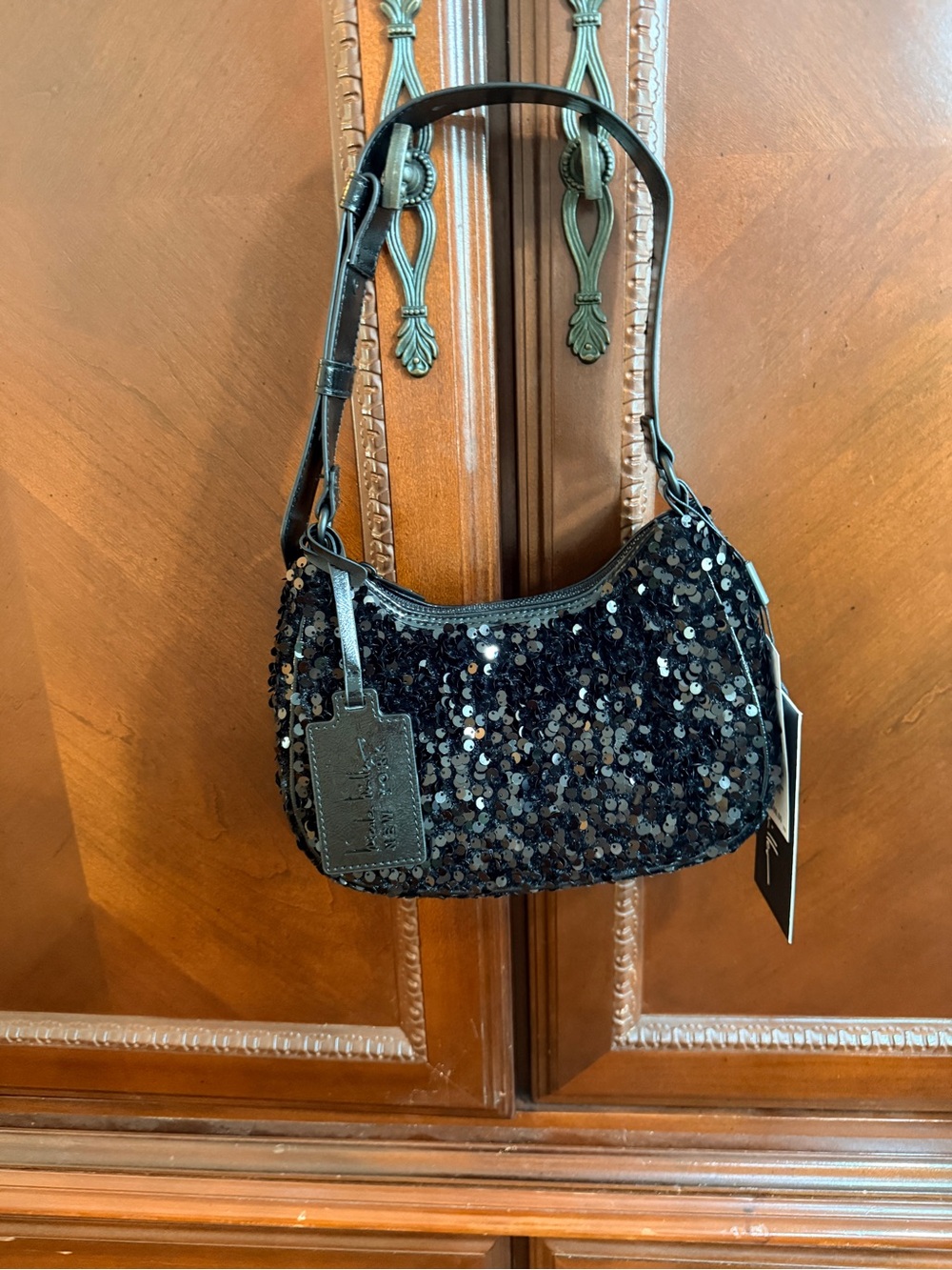 Nicole Miller NWT sequin &
Patent leather evening bag.
Adjustable strap
